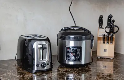 a toaster and coffee maker sitting on a counter at Big Luxury 2 Bedroom Condo, Free Parking, Near Downtown, King size Bed in Longueuil