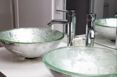 a bathroom sink with two green bowls and a faucet at Big Luxury 2 Bedroom Condo, Free Parking, Near Downtown, King size Bed in Longueuil