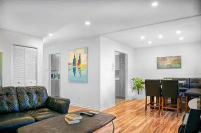 a living room with a couch and a table at Big Luxury 2 Bedroom Condo, Free Parking, Near Downtown, King size Bed in Longueuil