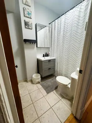 a bathroom with a toilet and a sink and a shower at La Pause Montréal in Montréal
