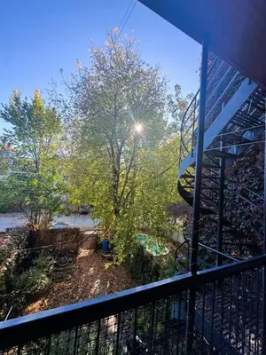 a view of a balcony with a tree and a staircase at La Pause Montréal in Montréal