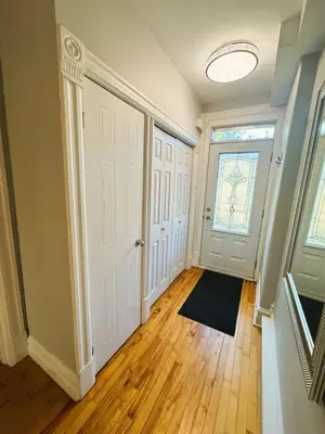 an empty hallway with a door and a window at La Pause Montréal in Montréal