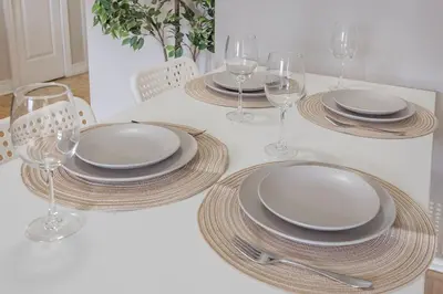 a table with plates and wine glasses on it at Outstanding 1BR in Heart of Downtown Montreal in Montréal