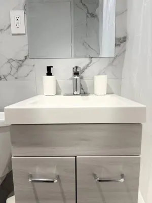a bathroom with a sink and a white counter at McGill Les Petits Studios, Downtown & Nightlife in Montréal