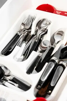 a white tray filled with forks knives and spoons at Charmant 2BD in Montréal