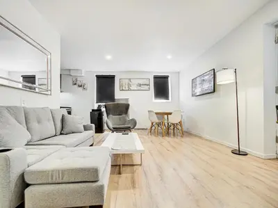 a living room with a couch and a table at Charmant 2BD in Montréal