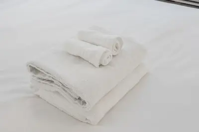 a pile of towels sitting on top of a mirror at Spacious and Cozy 1BR - Near Old Port in Montréal