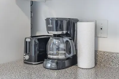 a blender sitting on a counter next to a roll of paper towels at Spacious and Cozy 1BR - Near Old Port in Montréal