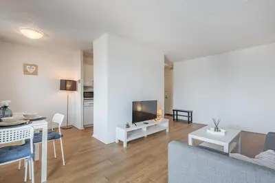 a living room with a couch and a table at 1BR Downtown MTL - Walk to Old Port in Montréal