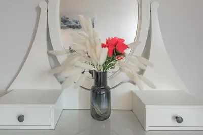a vase with red and white flowers in it at 1BR Downtown MTL - Walk to Old Port in Montréal