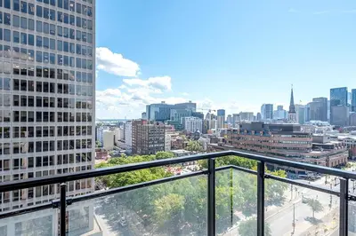 a view of a city from the balcony of a building at Downtown Montreal 1BR - Sleeps 4 in Montréal