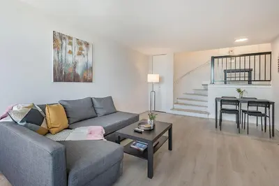 a living room with a couch and a table at Modern 1BR - Central Location in Montréal