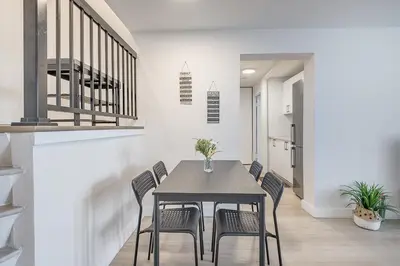 a dining room with a table and chairs at Modern 1BR - Central Location in Montréal