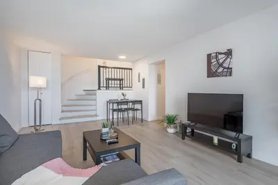 a living room with a couch and a table at Modern 1BR - Central Location in Montréal