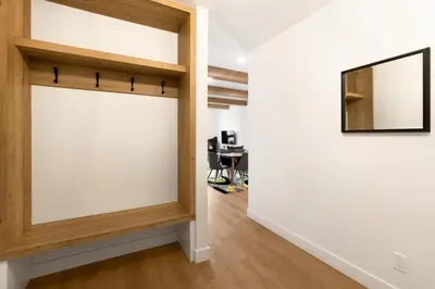 a sliding door in a room with a desk at Magnifique Condo pour 4 à Orford in Magog-Orford