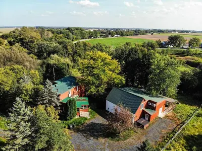 an overhead view of a house in the trees at Bashtina Inn and Spa in Saint-Césaire