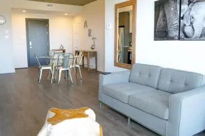 a living room with a couch and a table at Corporate Stays Monarc Bedroom in Montréal