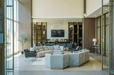 a living room with a couch and chairs and a tv at Corporate Stays Monarc 2 Bedrooms in Montréal