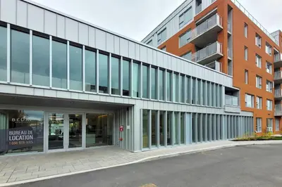 an external view of a building with a parking lot at Corporate Stays Blum 2 Bedrooms in Brossard