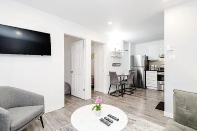 a living room with a couch and a table at Modern Apartment in Montreal in Montréal
