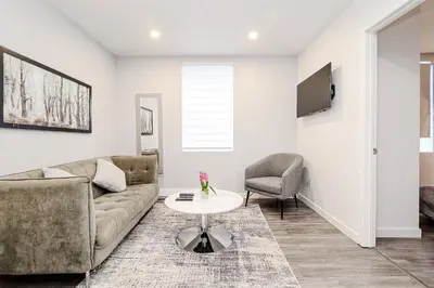 a living room with a couch and a table at Modern Apartment in Montreal in Montréal