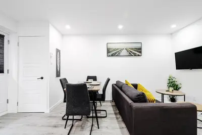 a living room with a couch and a table at Appartement 2 chambres Downtown Montréal in Montréal