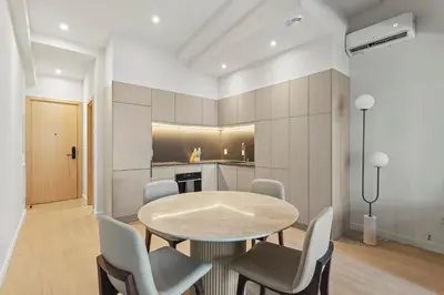 a dining room with a table and chairs at Miles by Alta in Montréal