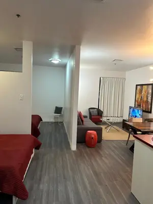 a living room with a couch and a table at Cozy Open Space in Montréal