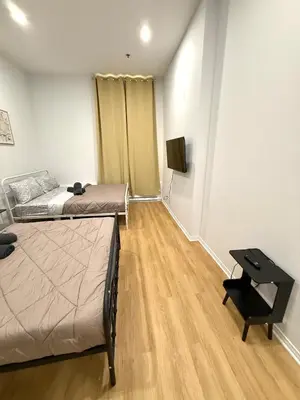a bedroom with a bed and a television in it at Big studio 4 persons apartment with Private FREE Parking in Montréal