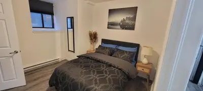 a bedroom with a bed in a room at Comfortable condo in Montreal in Montréal