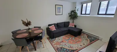 a living room with a couch and a table at Comfortable condo in Montreal in Montréal