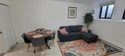 a living room with a couch and a table at Comfortable condo in Montreal in Montréal