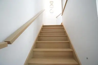 a staircase in a building with white walls at Loup in Magog-Orford