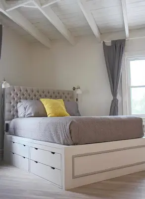 a bedroom with a large bed in a room at Gite La Cache in Beloeil Village