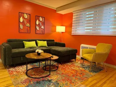 a living room with a couch and a table at Cute & Cozy Hub for Montreal Travelers in Montréal