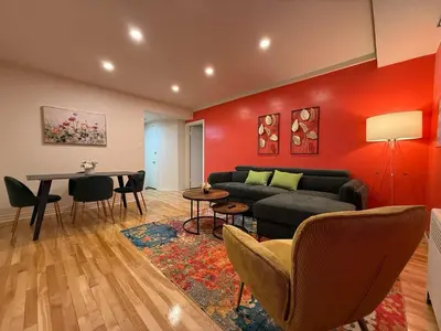 a living room with a couch and a table at Cute & Cozy Hub for Montreal Travelers in Montréal