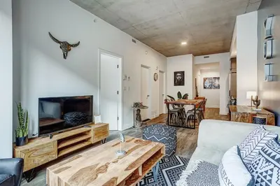 a living room with a couch and a table at Montreal - C Lofts Le Smith - 2B1B 1006 in Montréal