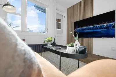 a living room with a couch and a table at The Speakeasy Suite 503 With Parking in Montréal