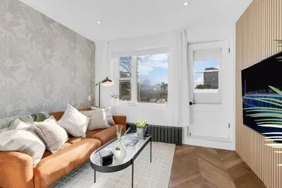 a living room with a couch and a table at The Speakeasy Suite 503 With Parking in Montréal