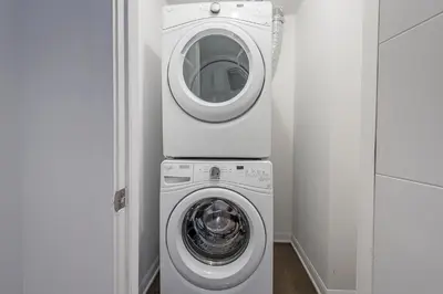 a washing machine and a washer in a room at Old Montreal Penthouse Iconic Location in Montréal
