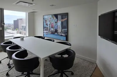 a meeting room with a white table and chairs at Pet-Friendly Furnished 1B Rental in Montreal with Skyline Views & Concierge in Montréal