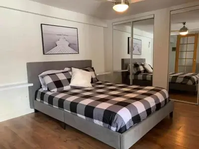 a bedroom with a bed and a mirror at Lake Access - Private Spa - Pool table - Rustique in Windsor