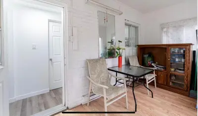 a dining room with a table and two chairs at Comfortable 4B Unit-Close to City Attractions in Montréal