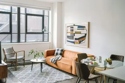 a living room with a couch and a table at The Cove Hotel in Montréal