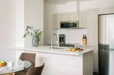 a kitchen with a plate of food on a counter at The Cove Hotel in Montréal