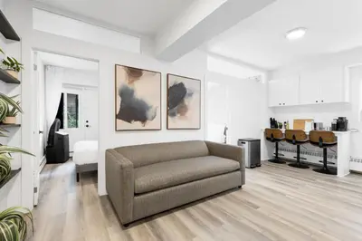 a living room with a couch and a table at The Sherbrooke Suite in Montréal