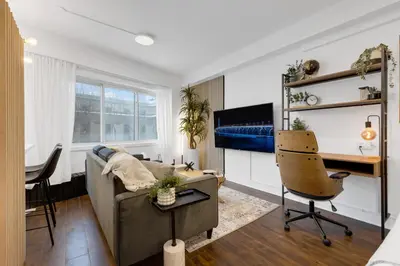 a living room with a couch and a desk at The Sherbrooke Suite 105 in Montréal