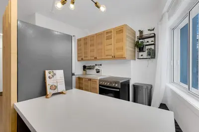 a small kitchen with a table and a counter top at The Sherbrooke Suite 105 in Montréal