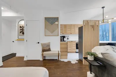 a living room and kitchen of a house at The Sherbrooke Suite 105 in Montréal