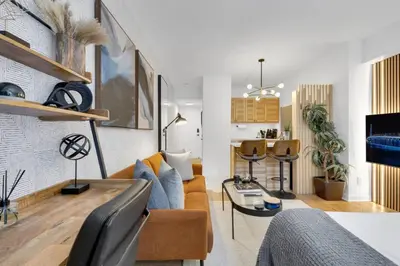 a living room with a couch and a table at The Sherbrooke Suite 99 in Montréal